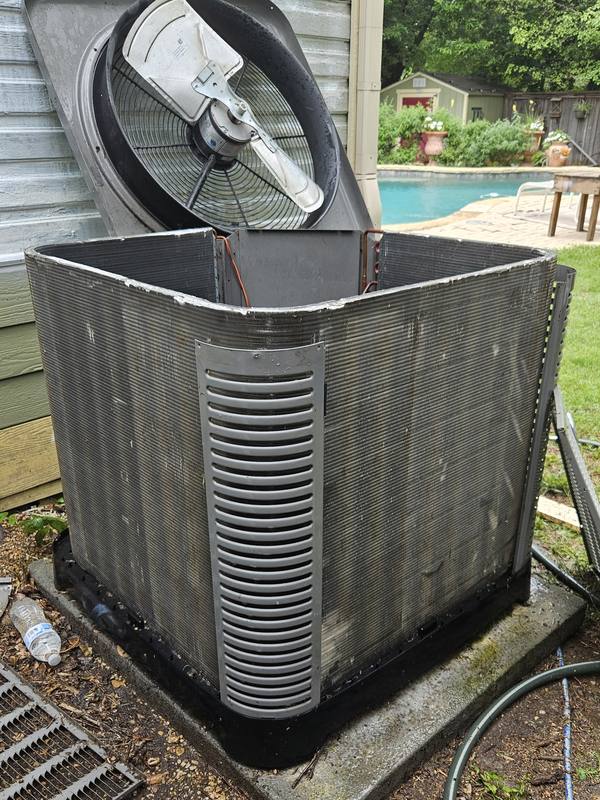 After: the same condenser coil cleaned, with the fan top still lifted