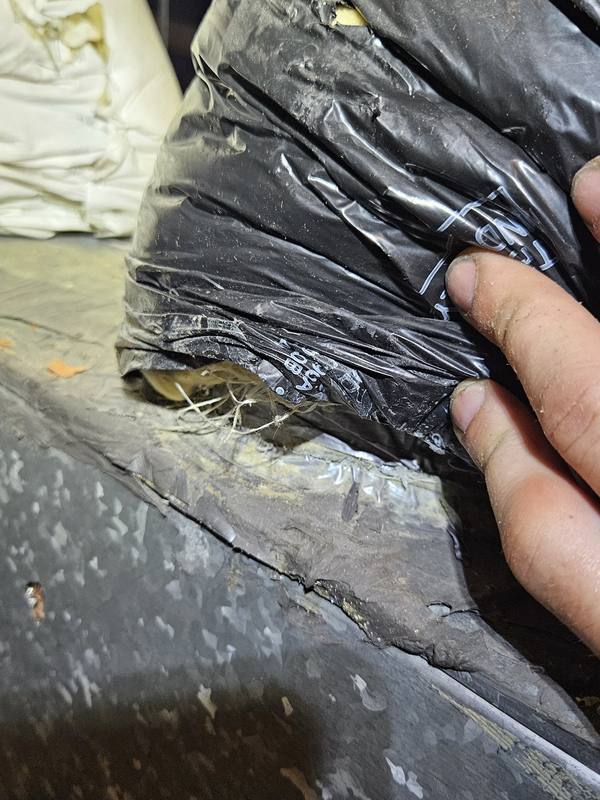 Before: flex duct pulled loose and torn at the plenum connection, with insulation exposed