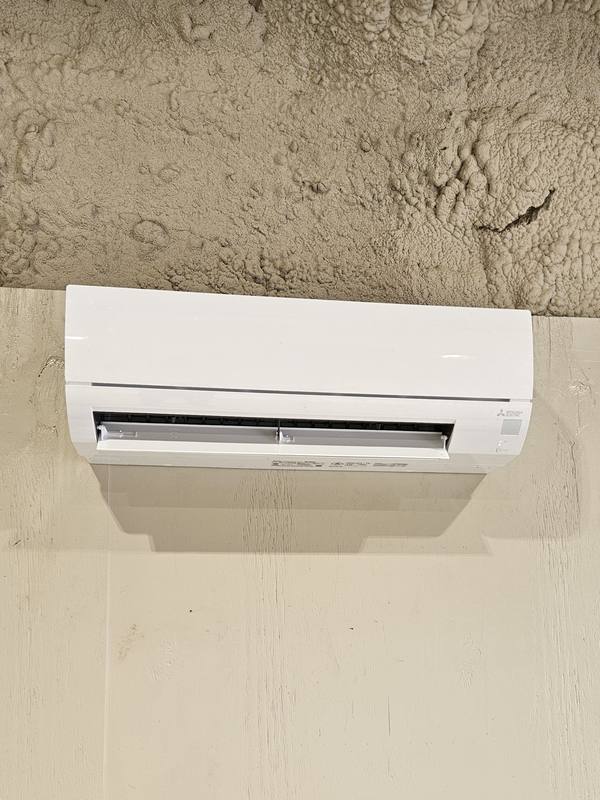 Mitsubishi Electric ductless mini-split indoor head installed in a shop building