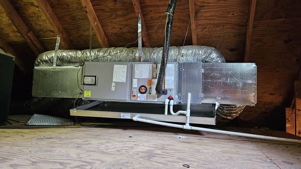 New Rheem air handler installed in an attic with a new plenum, secondary drain pan and PVC drain line